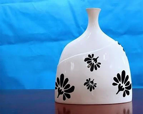 Laser marking in ceramic bottle -Dotslaser